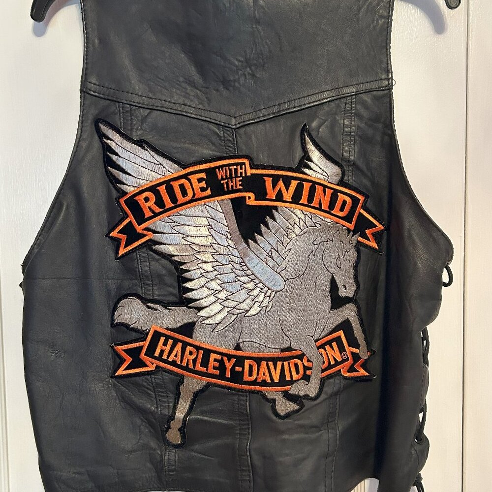 Vintage Leather Biker Vest with pins.